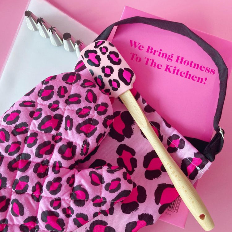Sweet As Co. pink and black leopard print kitchen baking kit with spatula, piping tips, apron & oven mit.