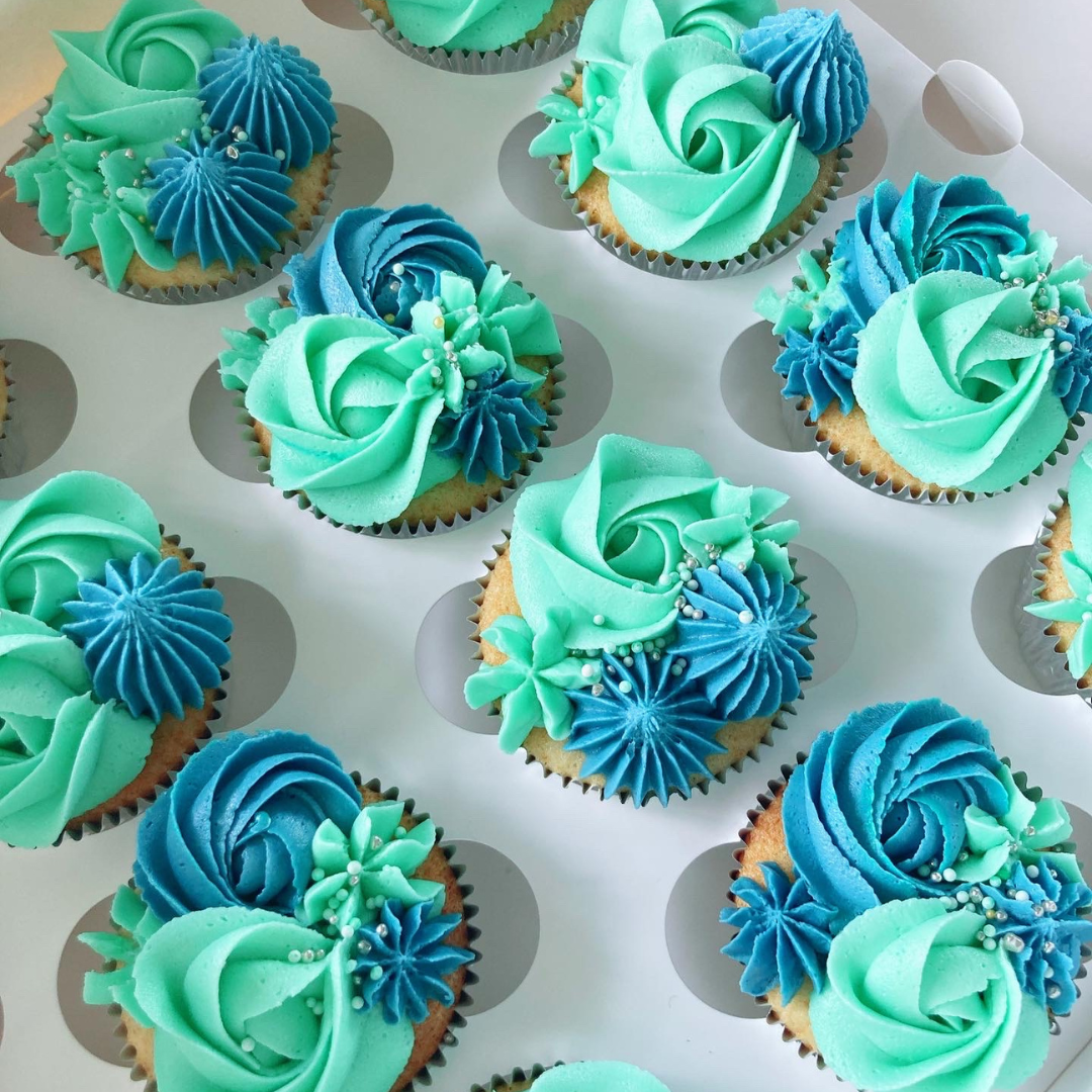 Cupcakes with green and blue frosting.