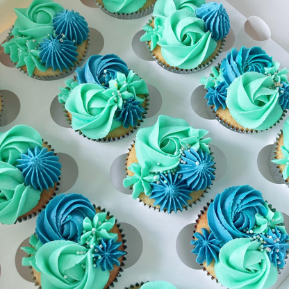 Cupcakes with green and blue frosting.