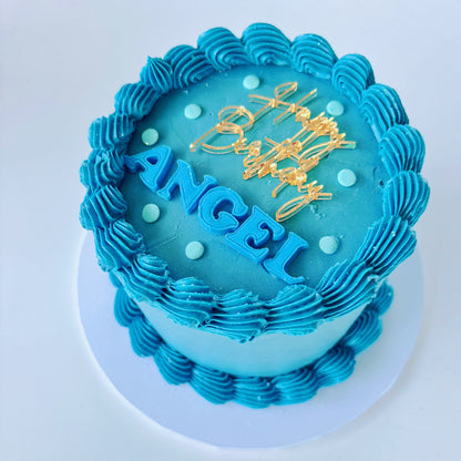 Blue chocolate 5 inch birthday cake with 'Happy Birthday Angel' mirror gold acrylic topper & fondant letters