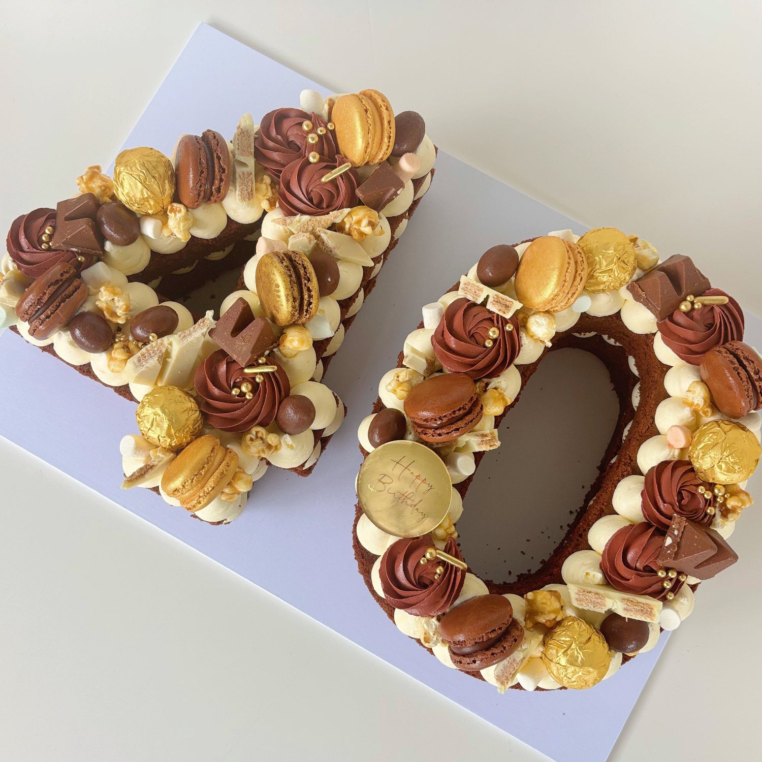 Number 40 chocolate cake with chocolate, gold macarons & buttercream