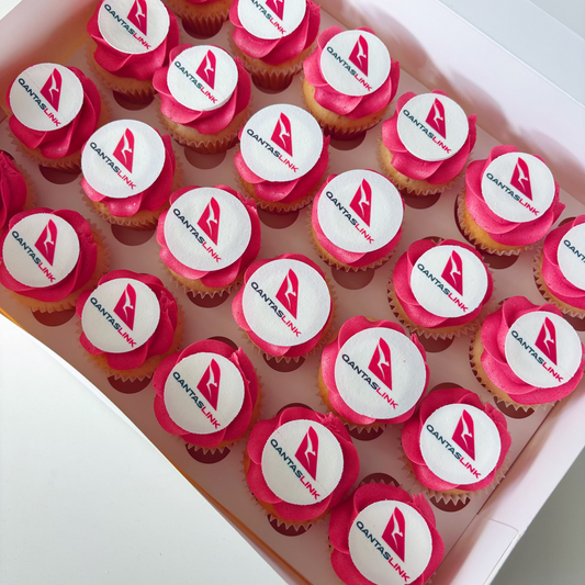 Box of 24 mini vanilla cupcakes with red buttercream & corporate logo on edible image