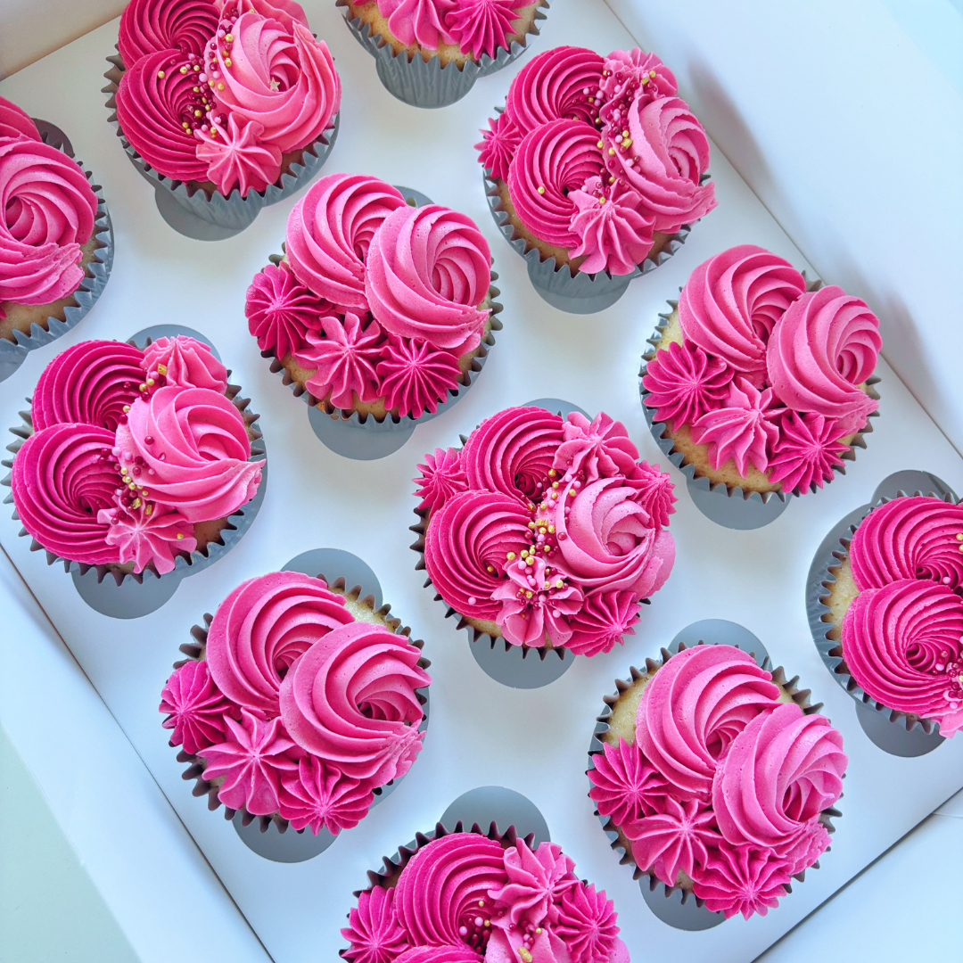 Cupcakes with pink buttercream frosting.