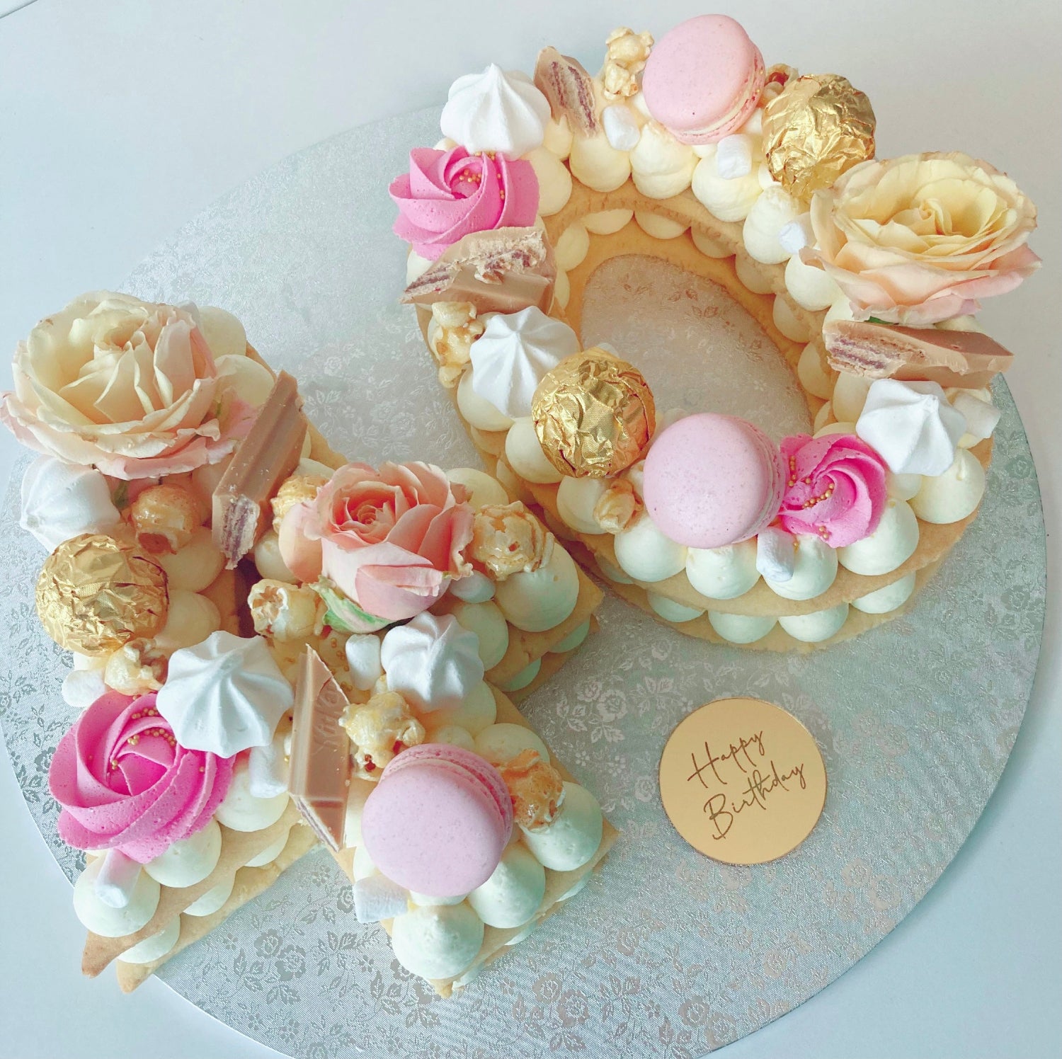 Number 40 Cookie cake with pink roses, macarons and mascarpone cream. 
