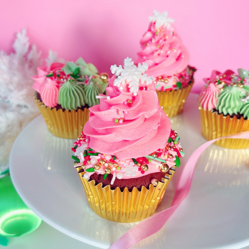 Decorative festive cupcakes with pink and green frosting.