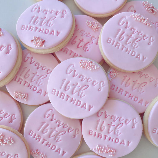Pink fondant cookies with 'Graces 16th Birthday' embossed
