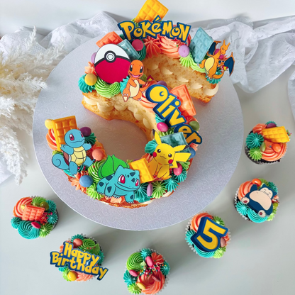 Colorful number 5 birthday cake with 'Pokémon' theme edible images and cupcakes.