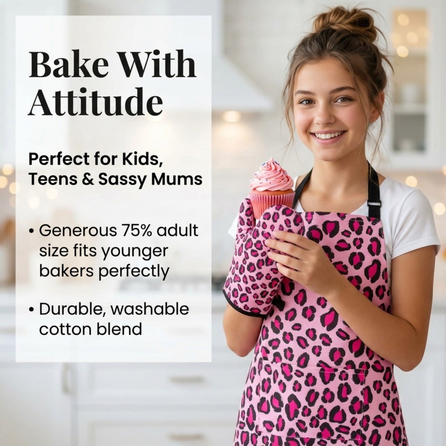 Teenager wearing a pink leopard print apron holding a cupcake in a kitchen setting.